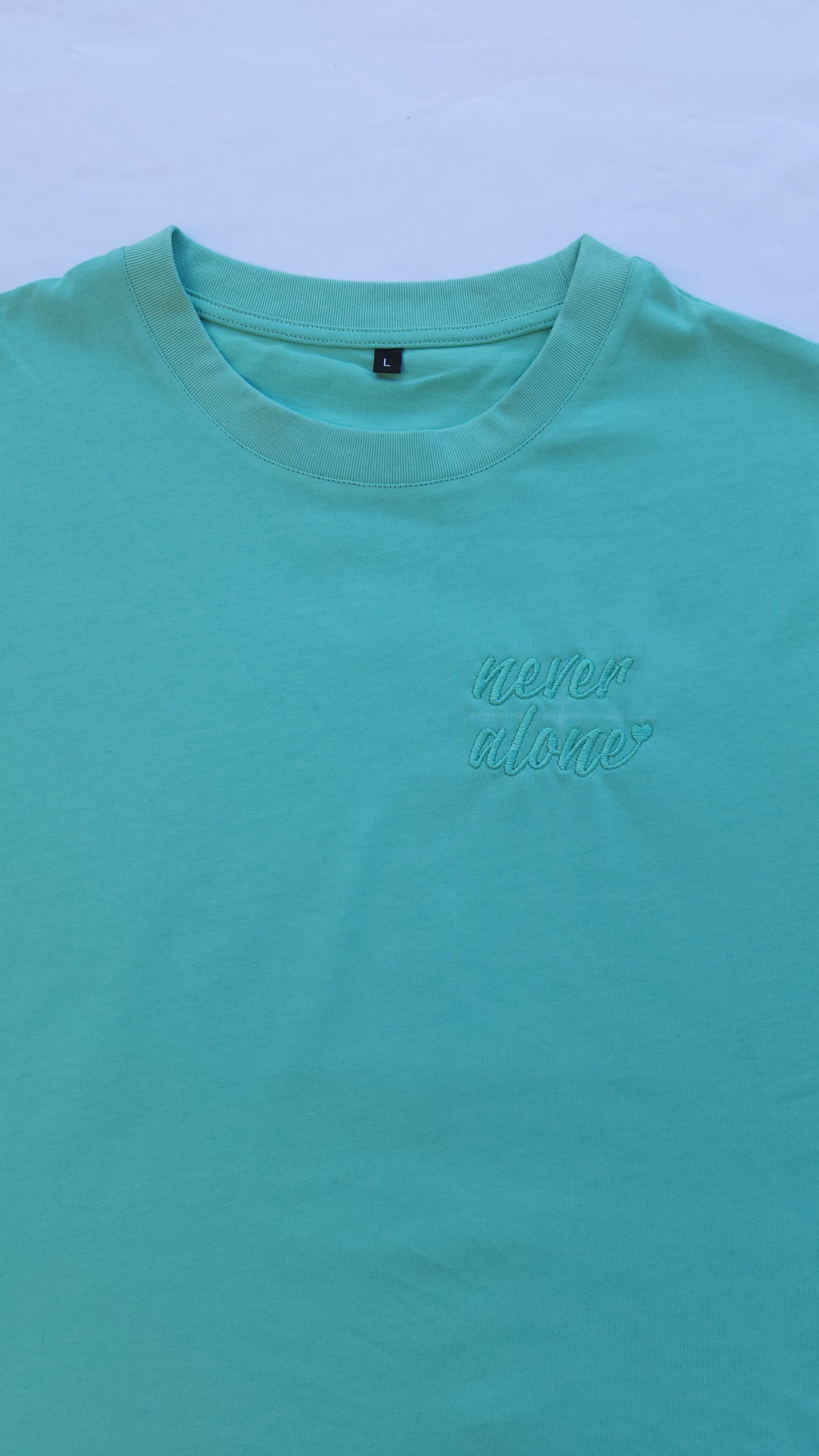 'Never Alone' Embroidered Oversized T-Shirt