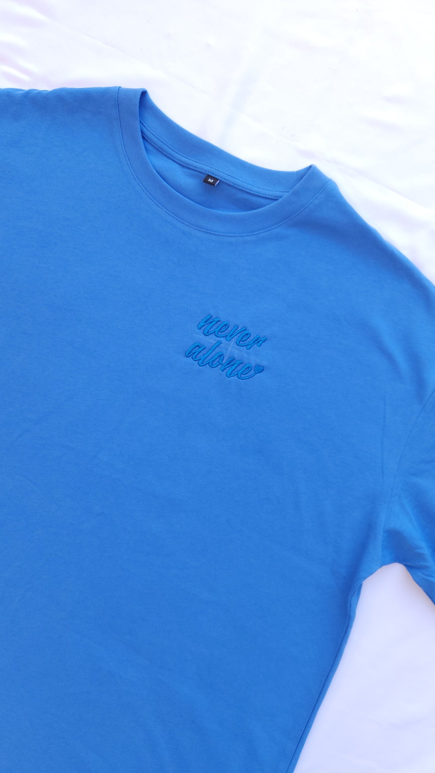 'Never Alone' Embroidered Oversized T-Shirt